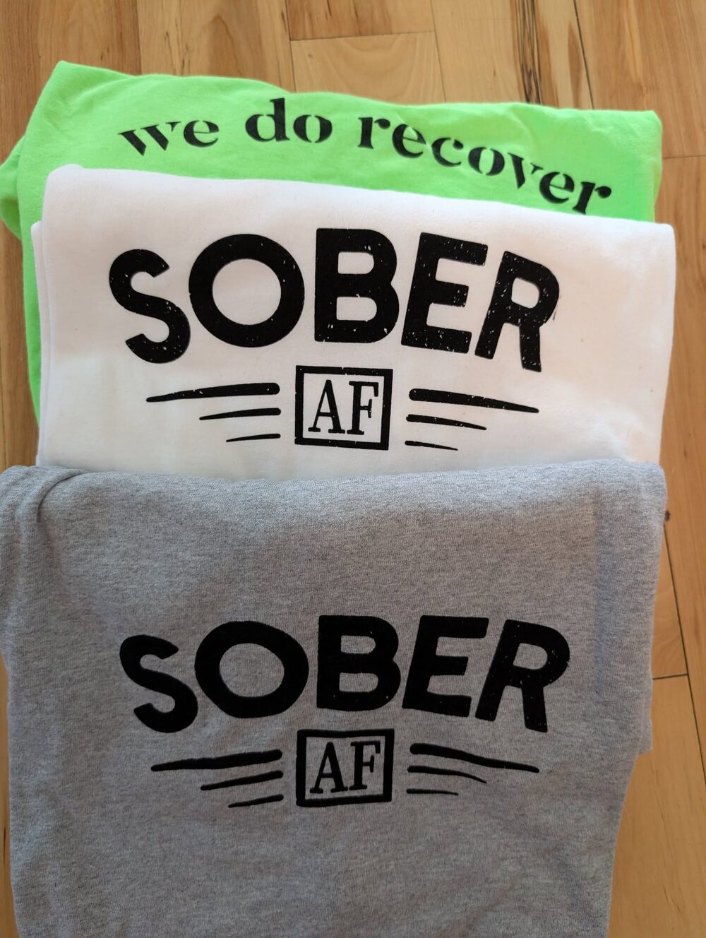 Stacked Sober AF and We Do Recover t-shirts